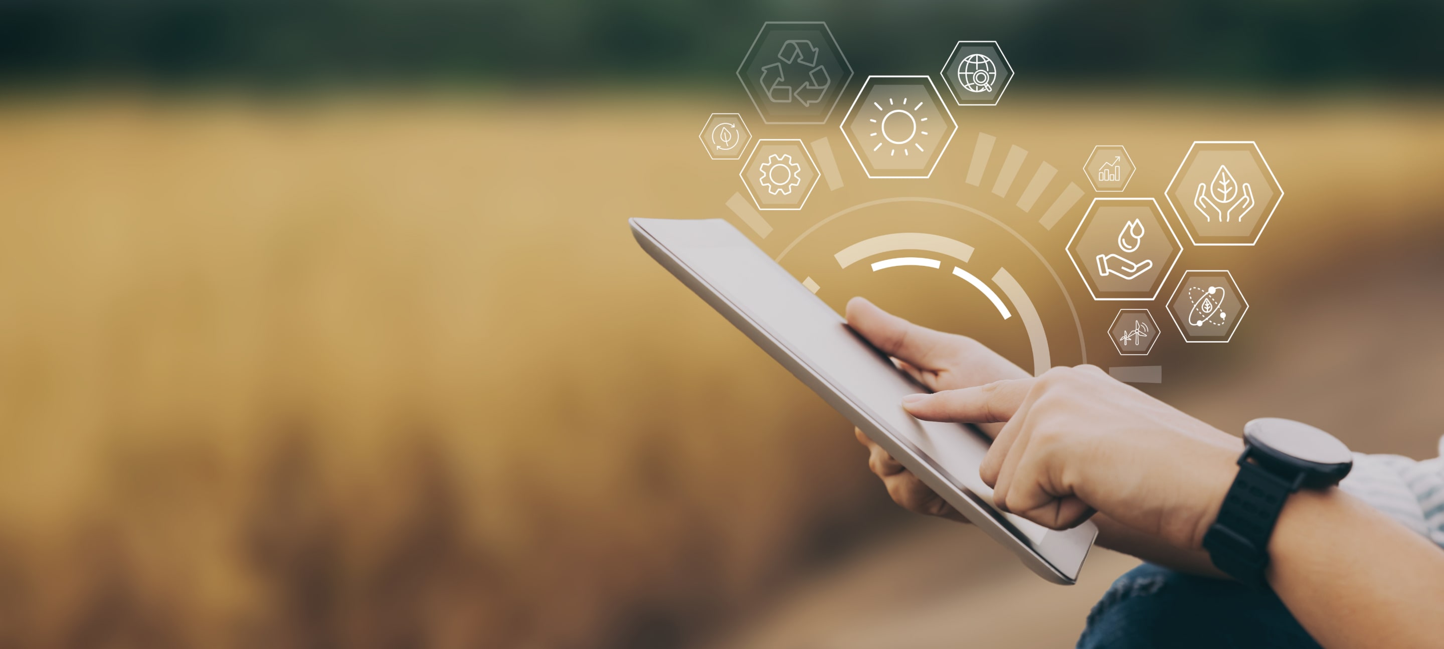 Close-up of a person using a digital tablet in a field with futuristic agricultural data overlays representing precision farming and smart agriculture.